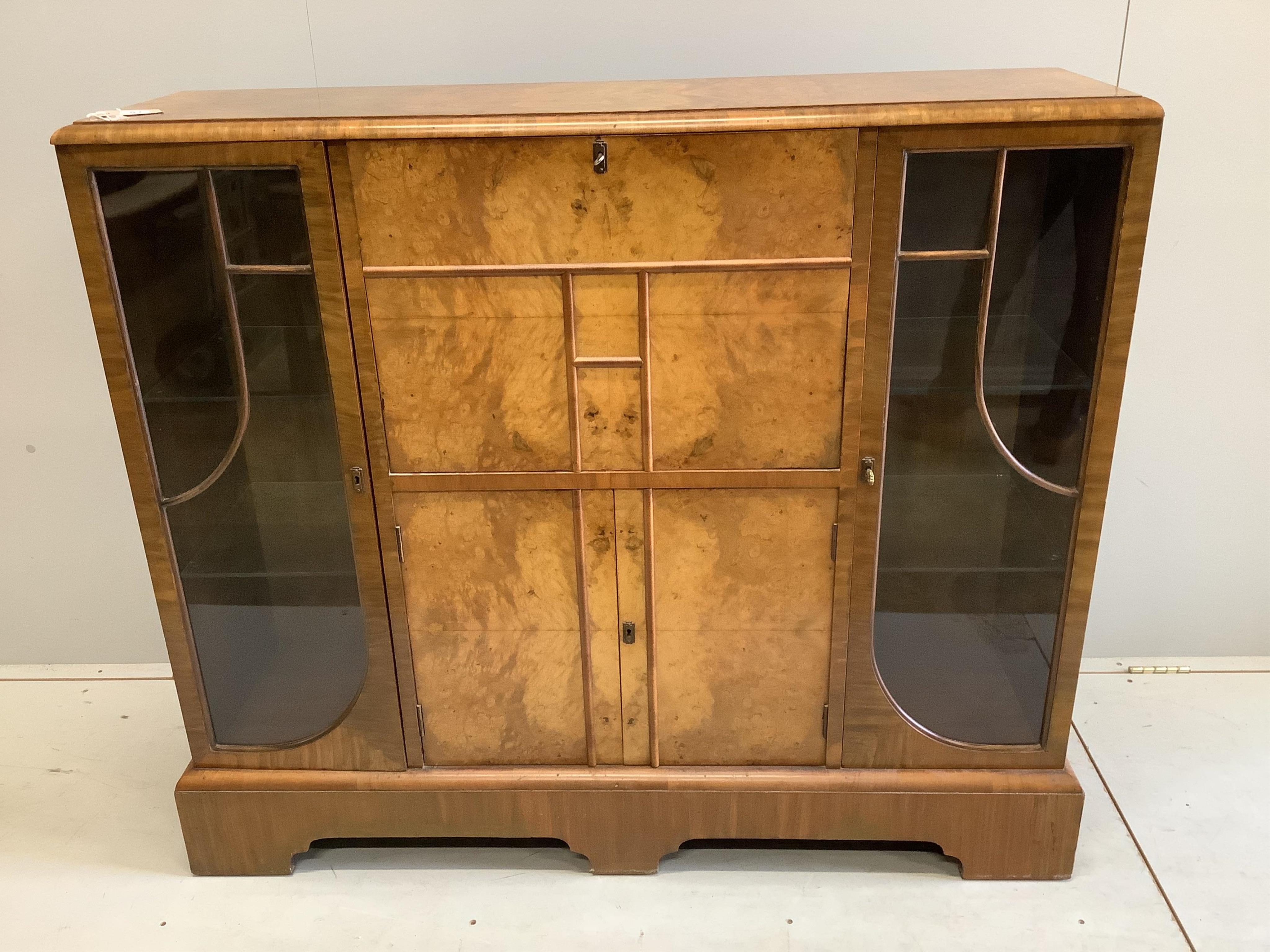 An early 20th century Art Deco style burr walnut secretaire cabinet, width 122cm, depth 34cm, height 107cm. Condition - fair to good